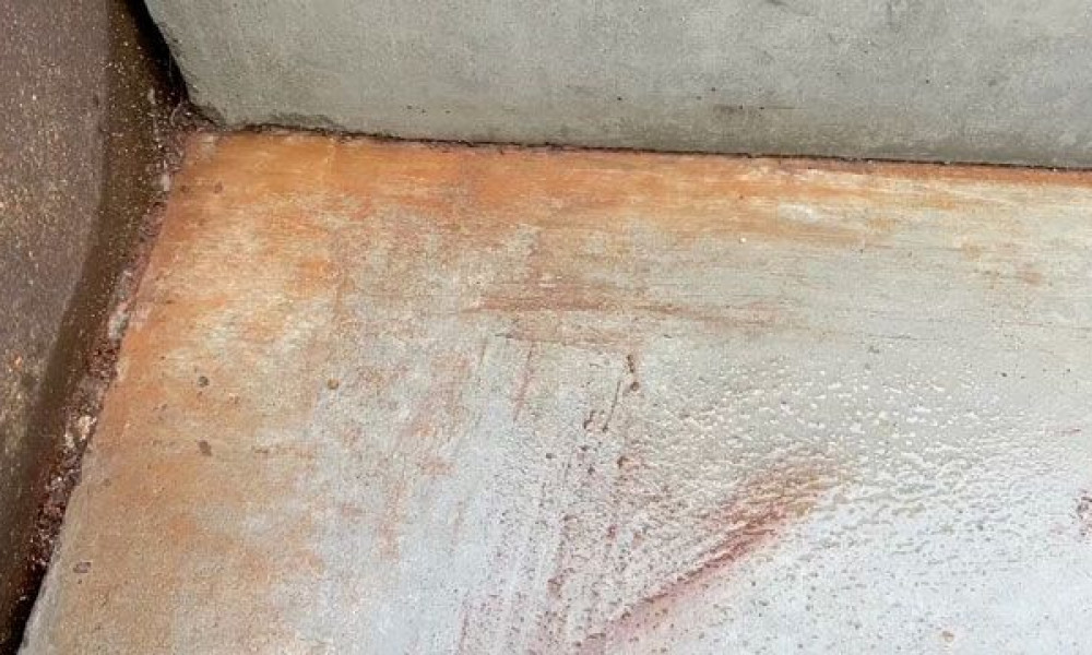 Rust on a concrete staircase